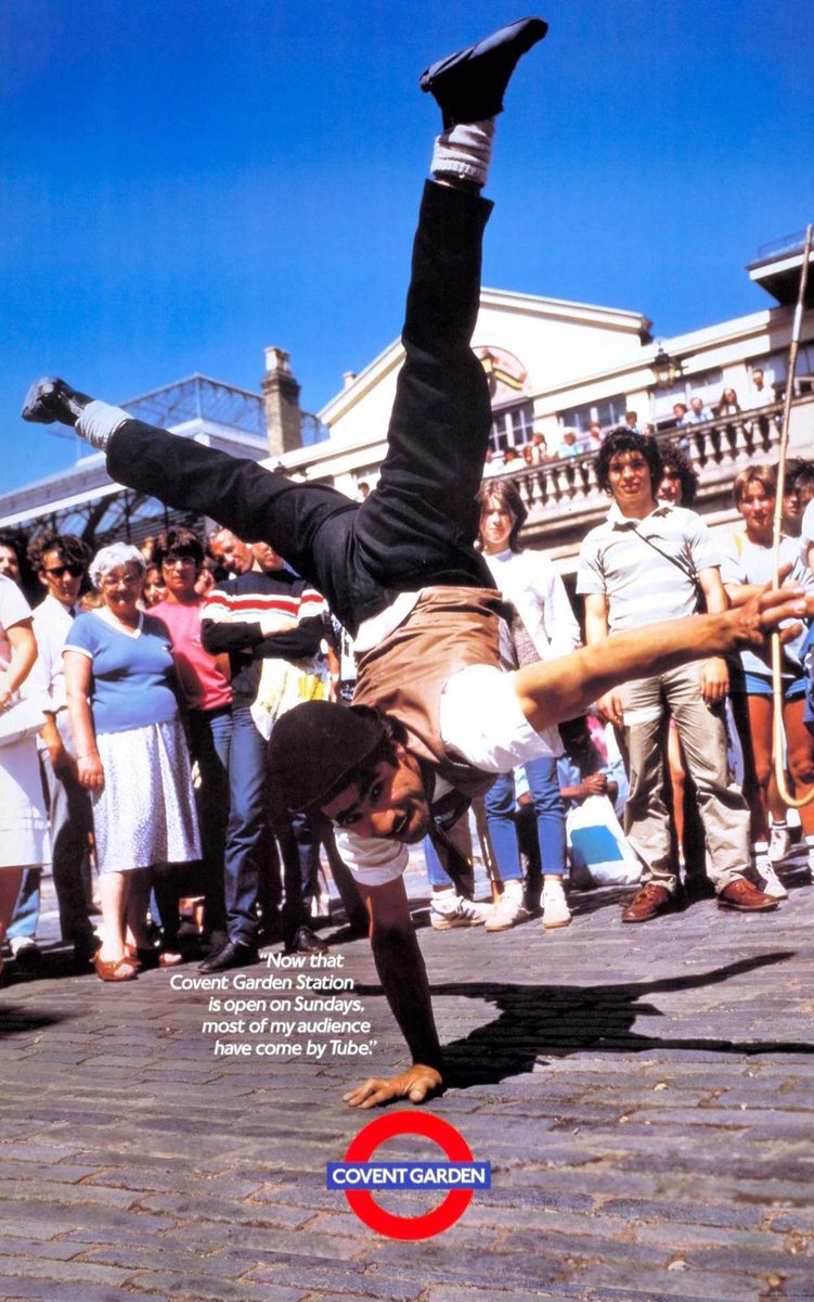London Underground promotional poster from 1987 featuring Charlie performing a one-handed handstand in Covent Garden