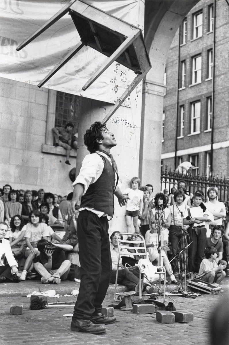 Charlie balancing a table on his forehead at Covent Garden